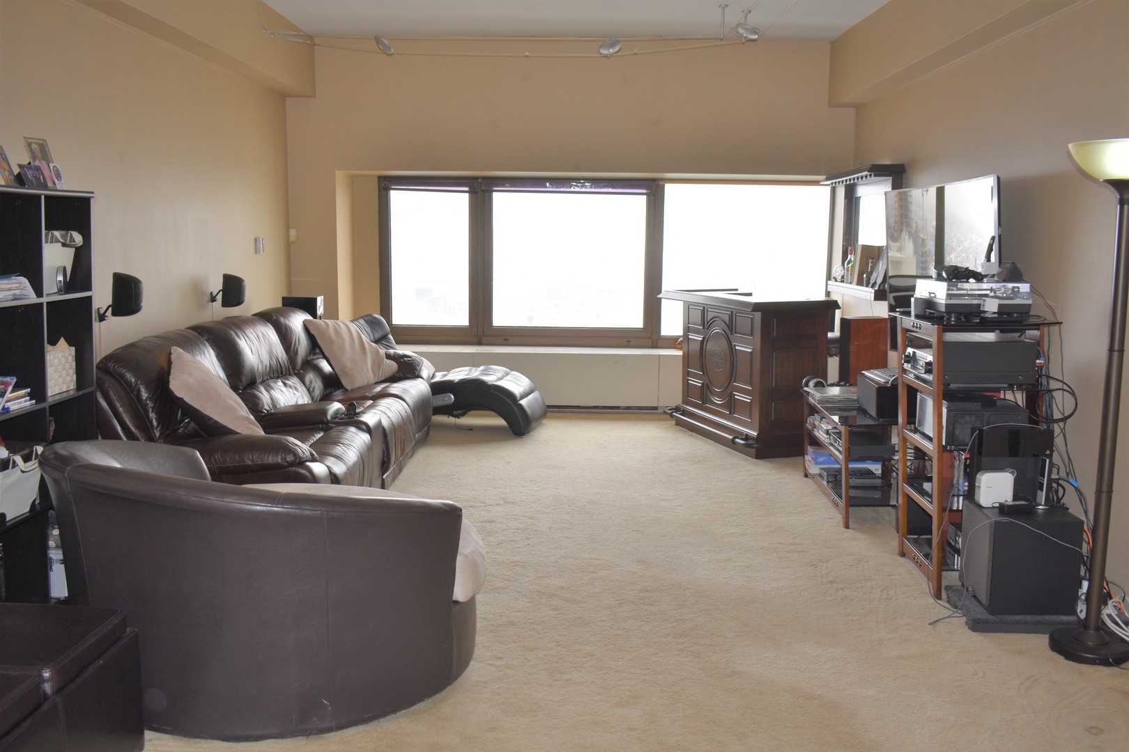 175 East Delaware Place, Unit 5501 Chicago, IL 60611 - Photo 11 of 37 a living room with furniture and a flat screen tv