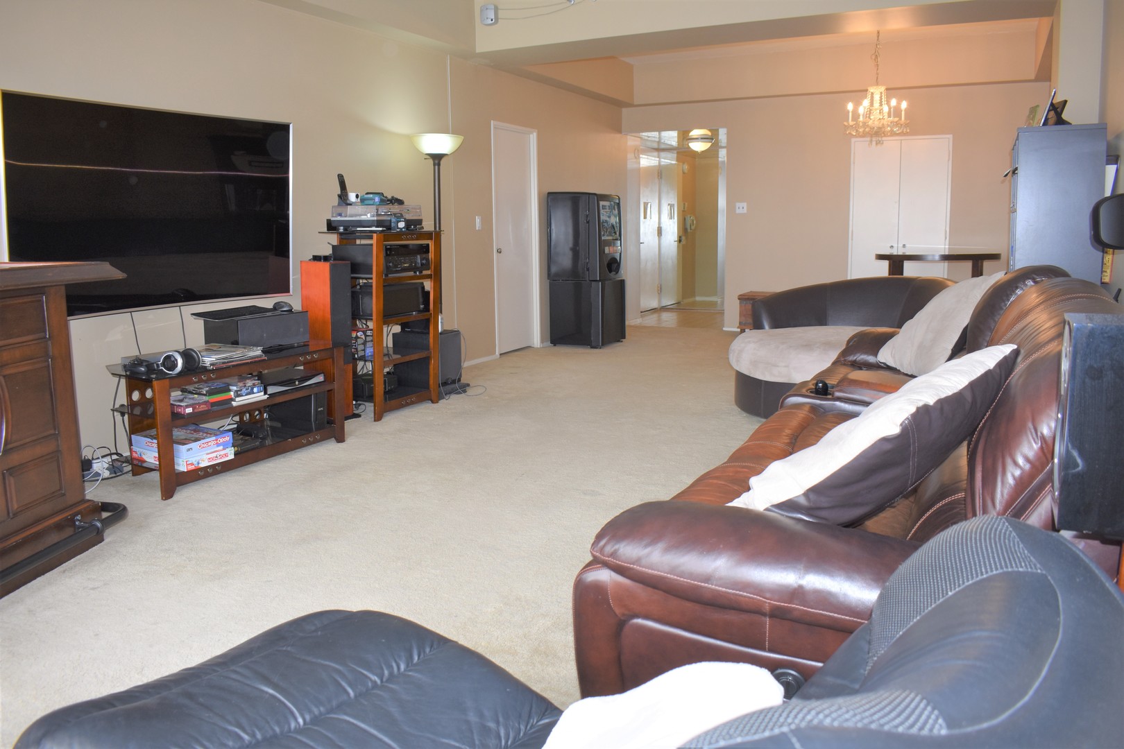 175 East Delaware Place, Unit 5501 Chicago, IL 60611 - Photo 13 of 37 a living room with furniture and a flat screen tv
