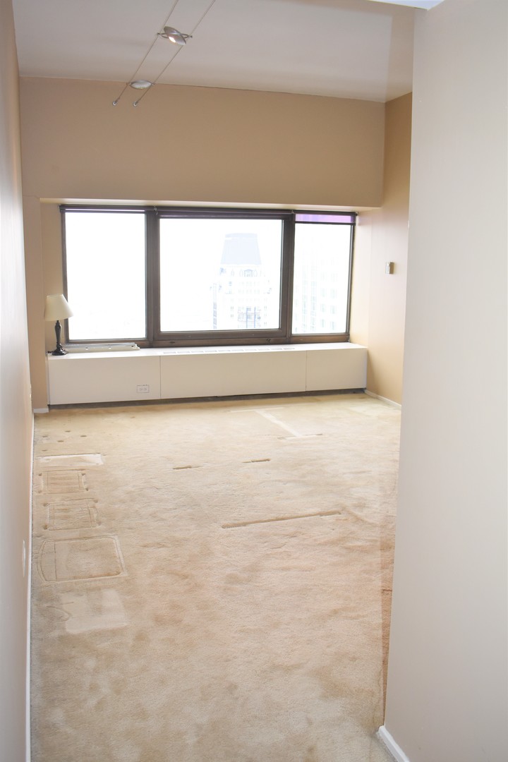 175 East Delaware Place, Unit 5501 Chicago, IL 60611 - Photo 20 of 37 a view of an empty room with a window