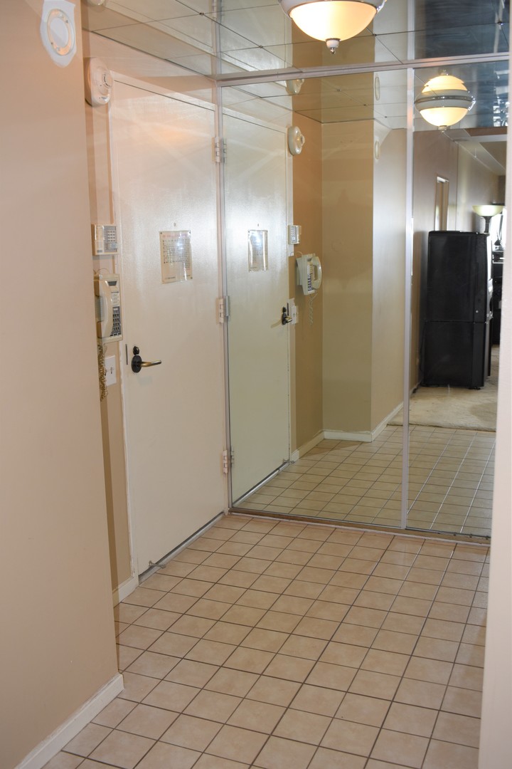 175 East Delaware Place, Unit 5501 Chicago, IL 60611 - Photo 5 of 37 a bathroom with a shower and a mirror