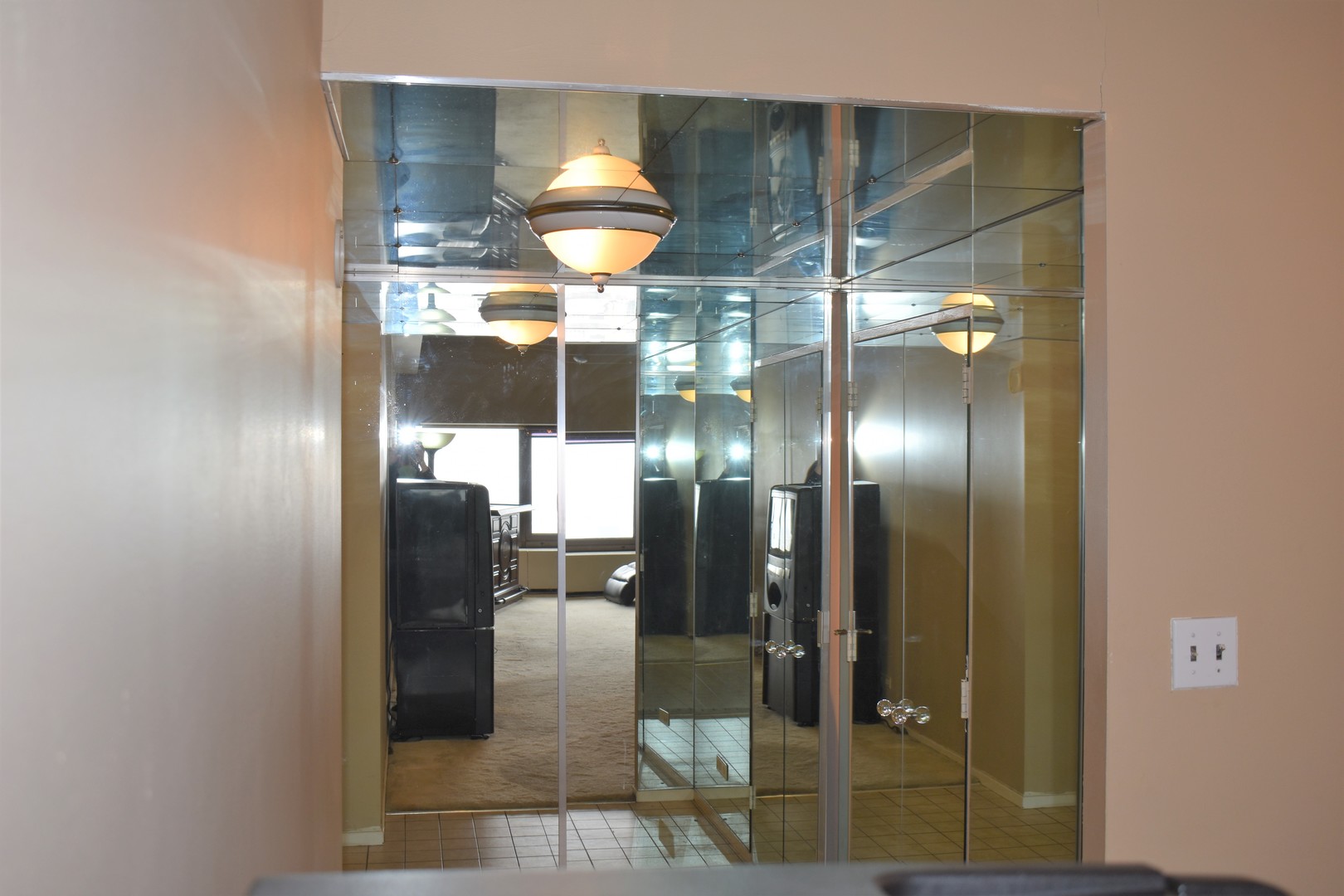 175 East Delaware Place, Unit 5501 Chicago, IL 60611 - Photo 7 of 37 a bathroom with a glass shower door
