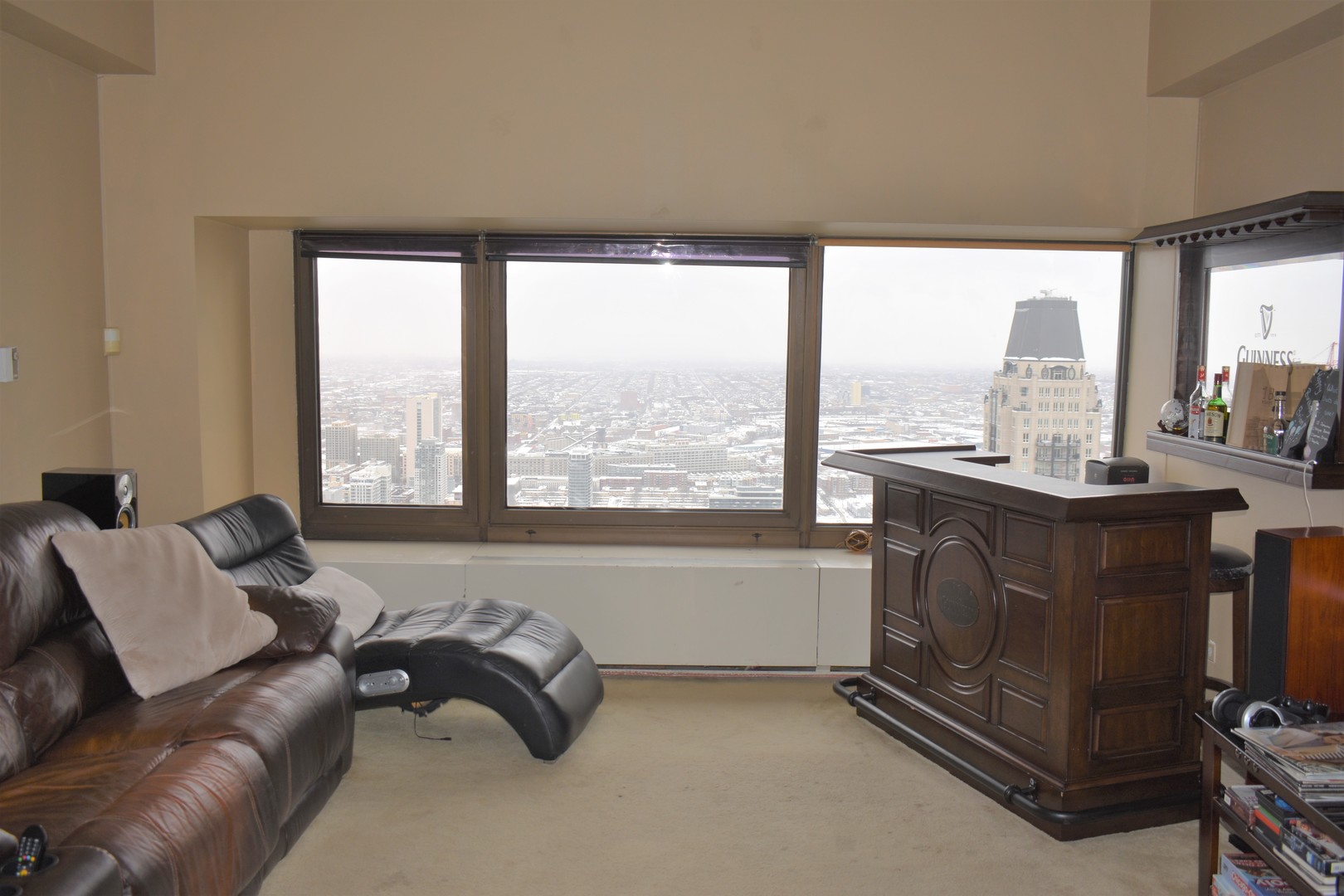 175 East Delaware Place, Unit 5501 Chicago, IL 60611 - Photo 10 of 37 a living room with furniture and a floor to ceiling window