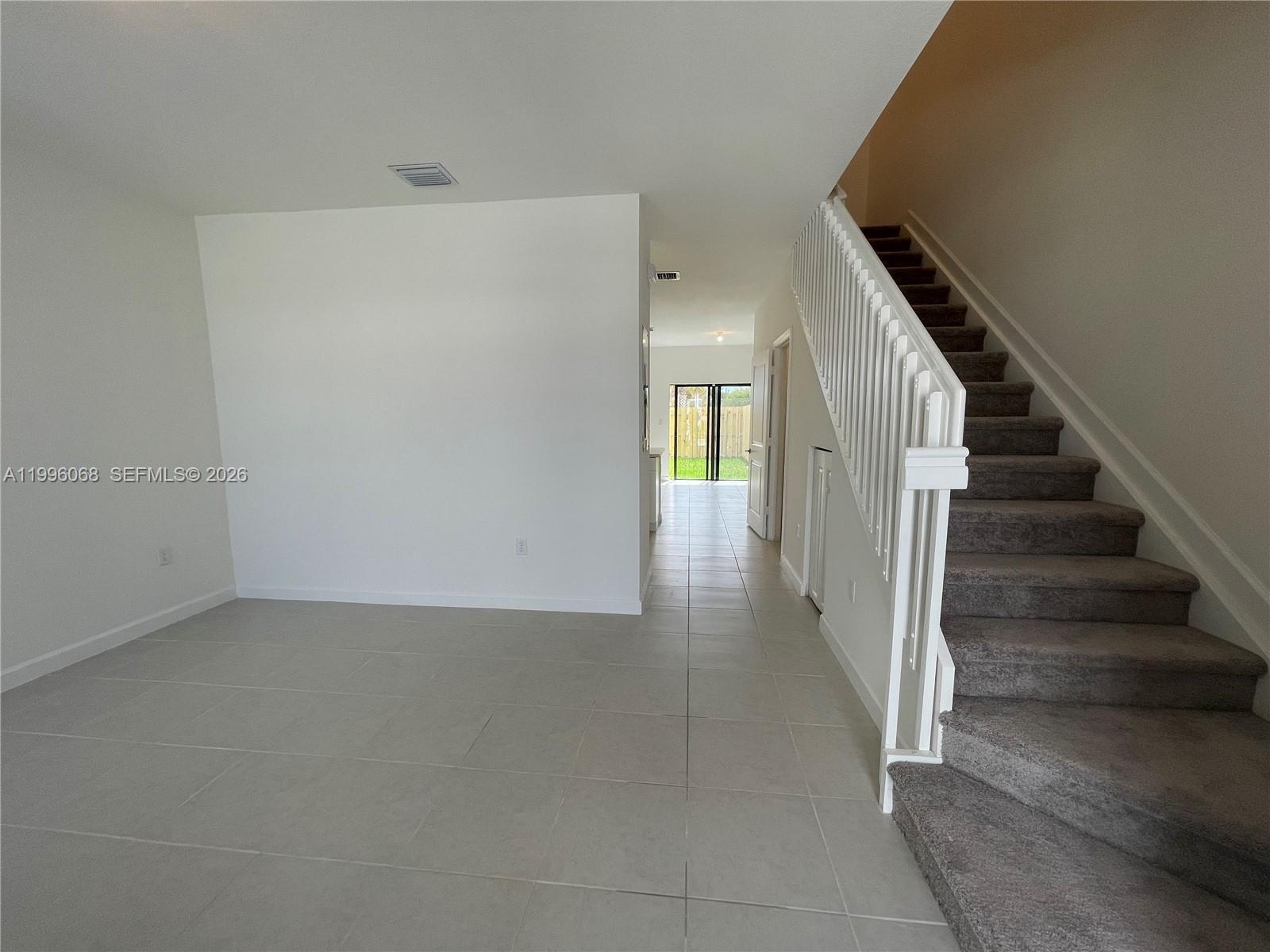 13262 Southwest 287th Terrace Homestead, FL 33033 - Photo 20 of 33 a view of a hallway with staircase