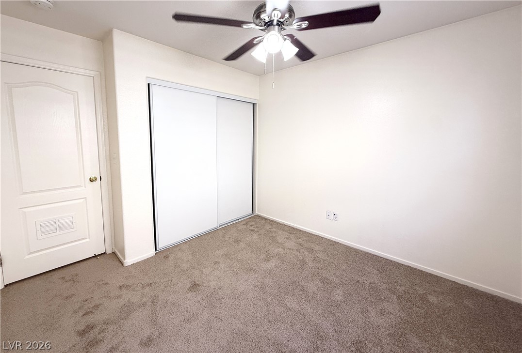 8870 Haviland Road Las Vegas, NV 89123 - Photo 16 of 22 A well-maintained bedroom with neutral tones offers a comfortable and inviting atmosphere.