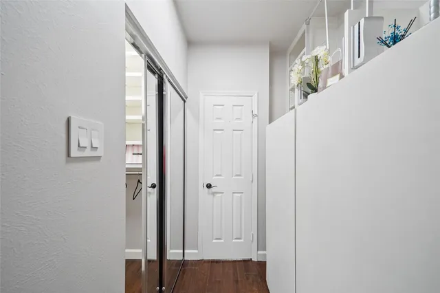 a view of an entryway with wooden floor