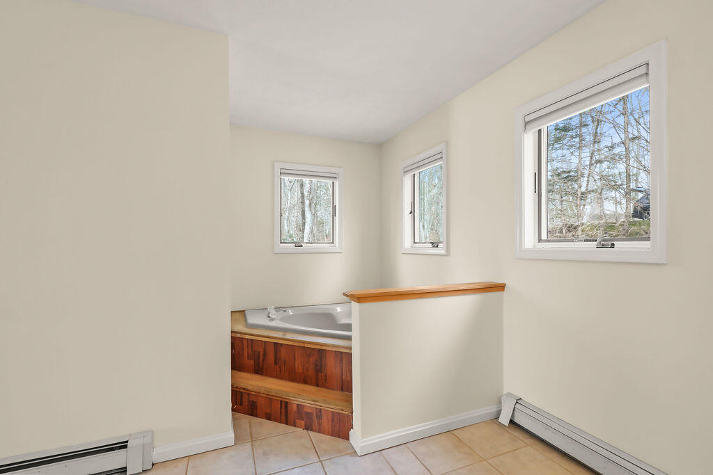 75 Edgewater Road Mashpee, MA 02649 - Photo 35 of 78 a view of room with window and wooden floor