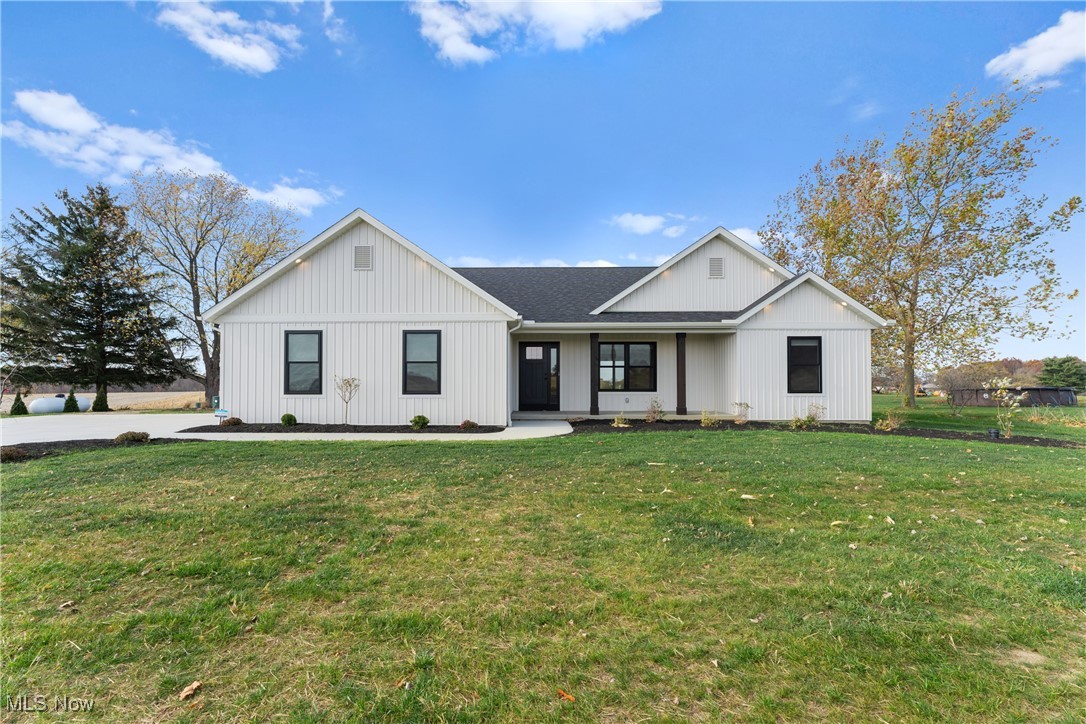 8664 Akron Road Marshallville, OH 44645 - Photo 2 of 29 Modern farmhouse style home featuring a front lawn