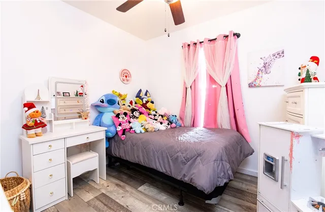 a bedroom with a bed and a baby crib
