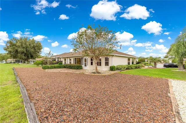 a view of house with yard