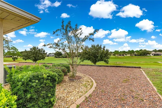a view of a golf course with a garden