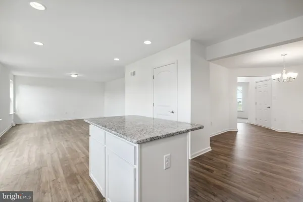 an empty room with wooden floor