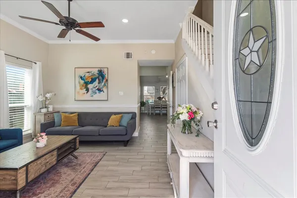 a living room with furniture and a flat screen tv