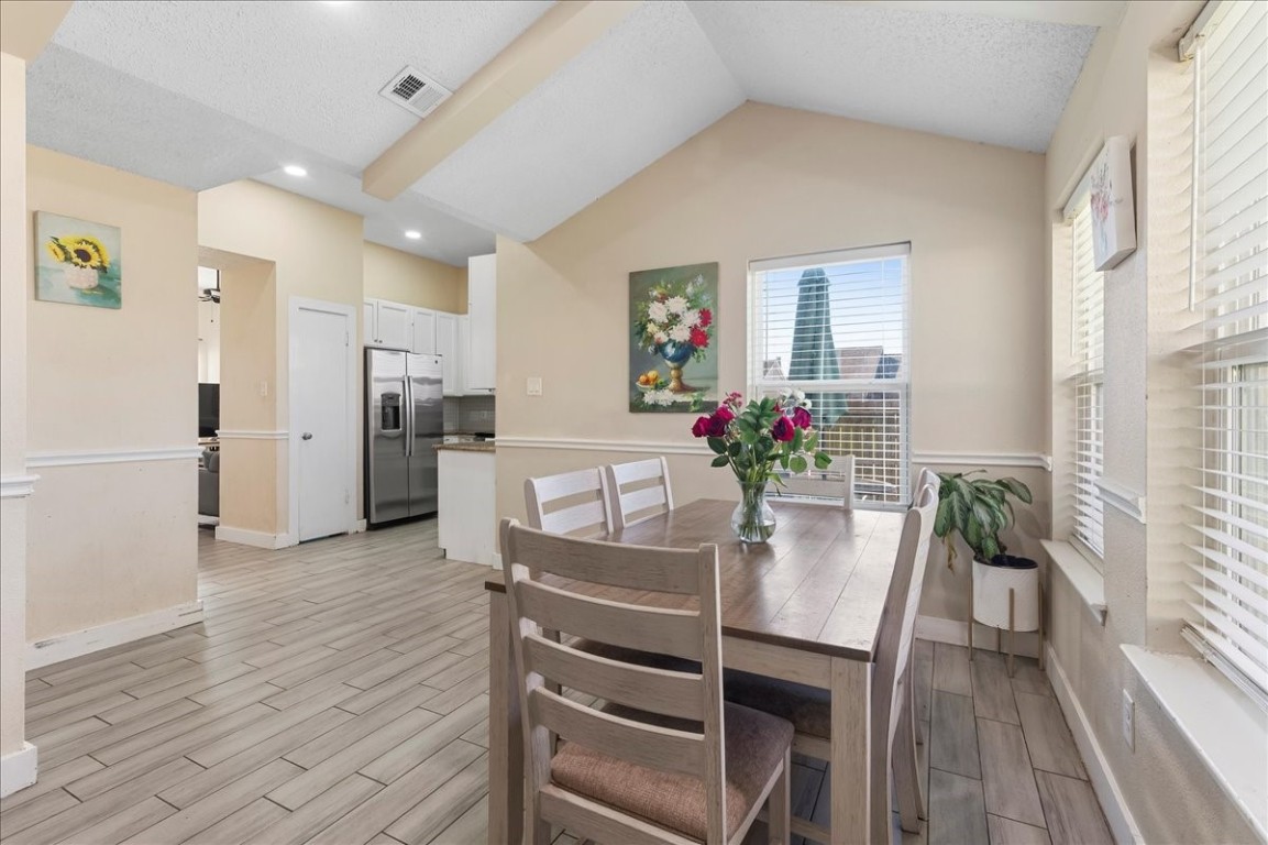 12926 Grovemill Drive Houston, TX 77045 - Photo 11 of 30 a view of a dining room with furniture and wooden floor