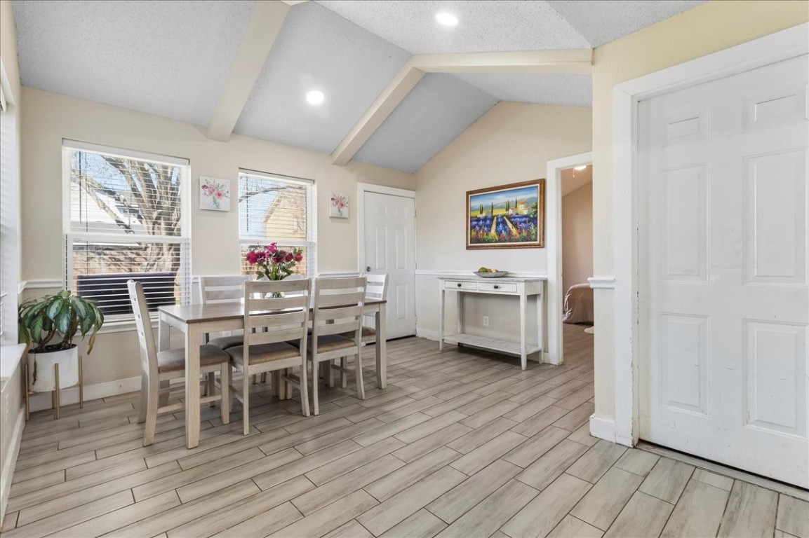 12926 Grovemill Drive Houston, TX 77045 - Photo 12 of 30 a view of a dining room with furniture and wooden floor