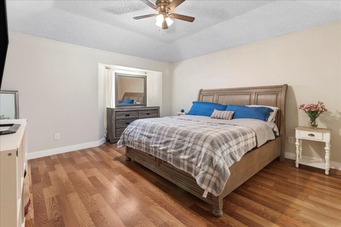 12926 Grovemill Drive Houston, TX 77045 - Photo 15 of 30 a bedroom with a bed and window