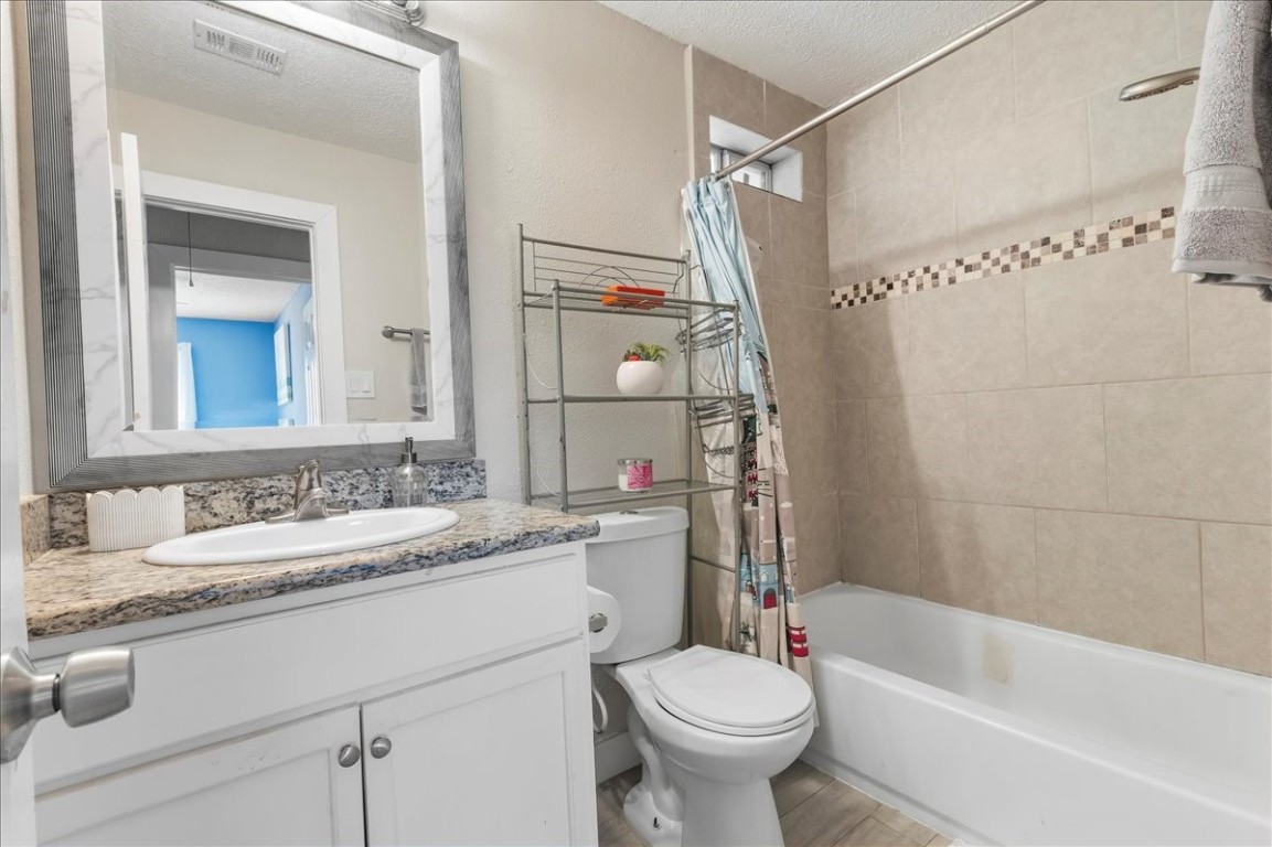 12926 Grovemill Drive Houston, TX 77045 - Photo 20 of 30 a bathroom with a sink toilet and shower