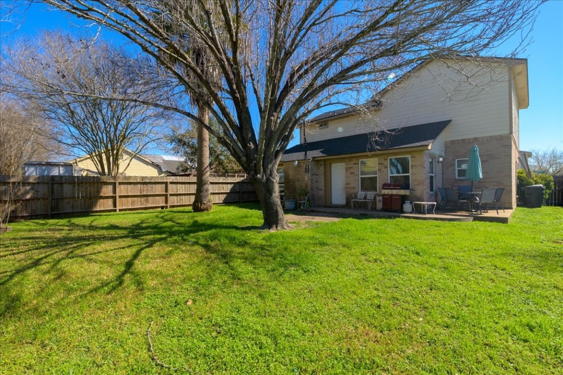 12926 Grovemill Drive Houston, TX 77045 - Photo 21 of 30 a view of a house with a yard