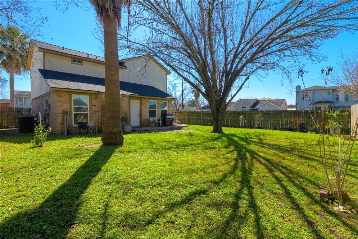 12926 Grovemill Drive Houston, TX 77045 - Photo 22 of 30 a view of a house with a yard