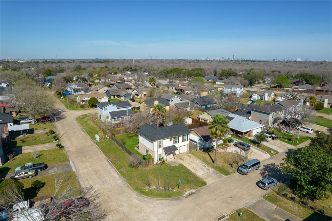 12926 Grovemill Drive Houston, TX 77045 - Photo 25 of 30 an aerial view of residential houses with outdoor space
