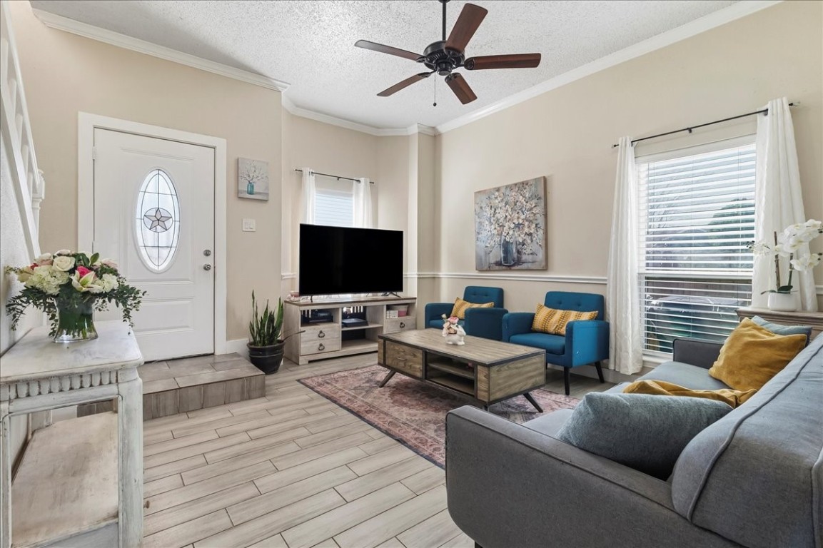 12926 Grovemill Drive Houston, TX 77045 - Photo 4 of 30 a living room with furniture and a flat screen tv