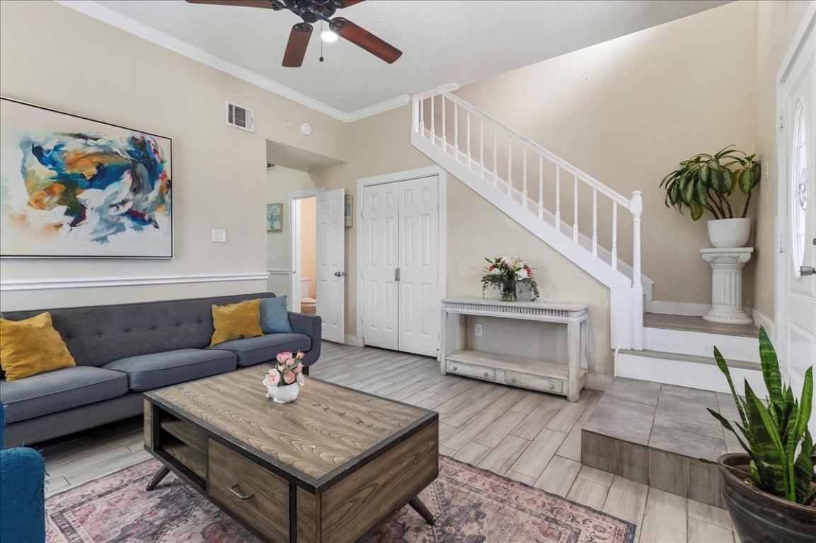 12926 Grovemill Drive Houston, TX 77045 - Photo 5 of 30 a living room with furniture and a potted plant