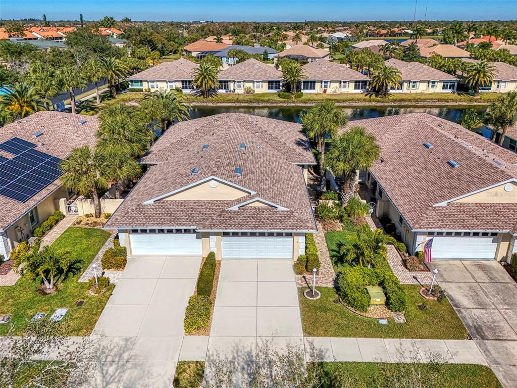 1771 Fountain View Circle Venice, FL 34292 - Photo 1 of 59 an aerial view of residential houses with outdoor space and swimming pool