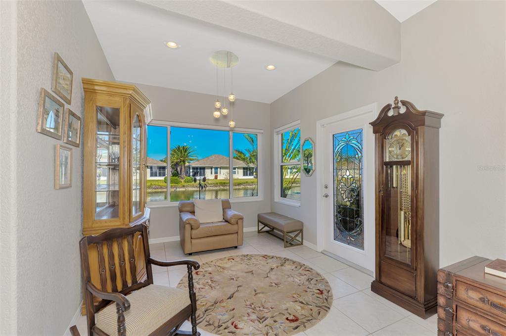 1771 Fountain View Circle Venice, FL 34292 - Photo 22 of 59 a living room with furniture and a large window