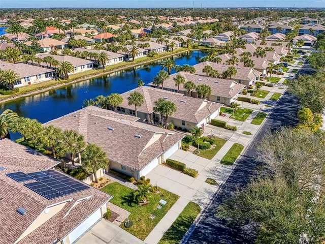 an aerial view of a house with a ocean view