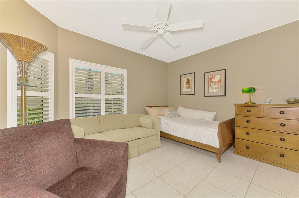 1771 Fountain View Circle Venice, FL 34292 - Photo 37 of 59 a spacious bedroom with a bed and a dresser