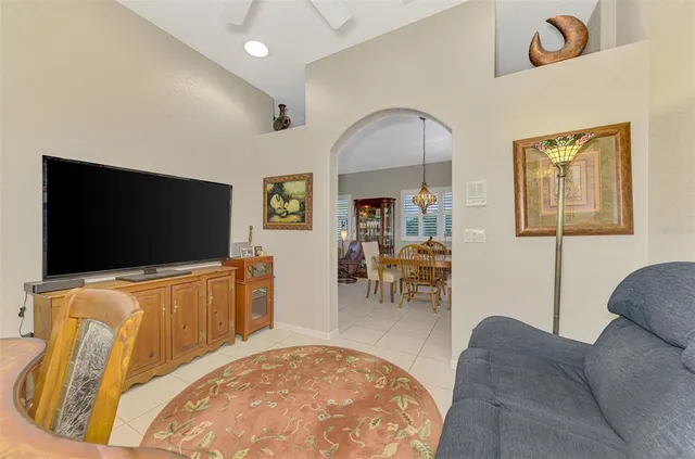 an aerial view of residential houses with outdoor space and swimming pool
