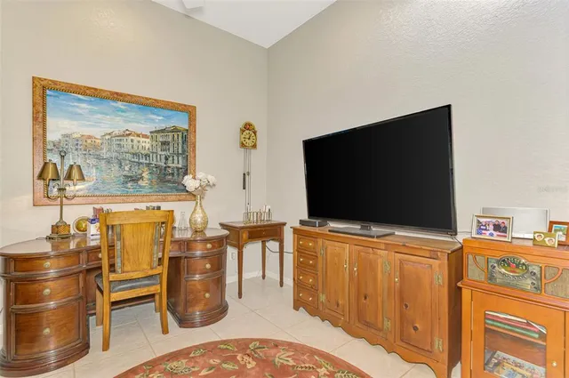an aerial view of residential houses with outdoor space and swimming pool