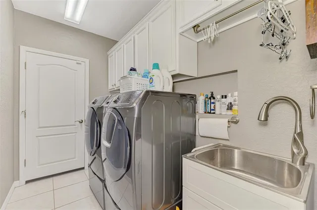 an aerial view of residential houses with outdoor space and river