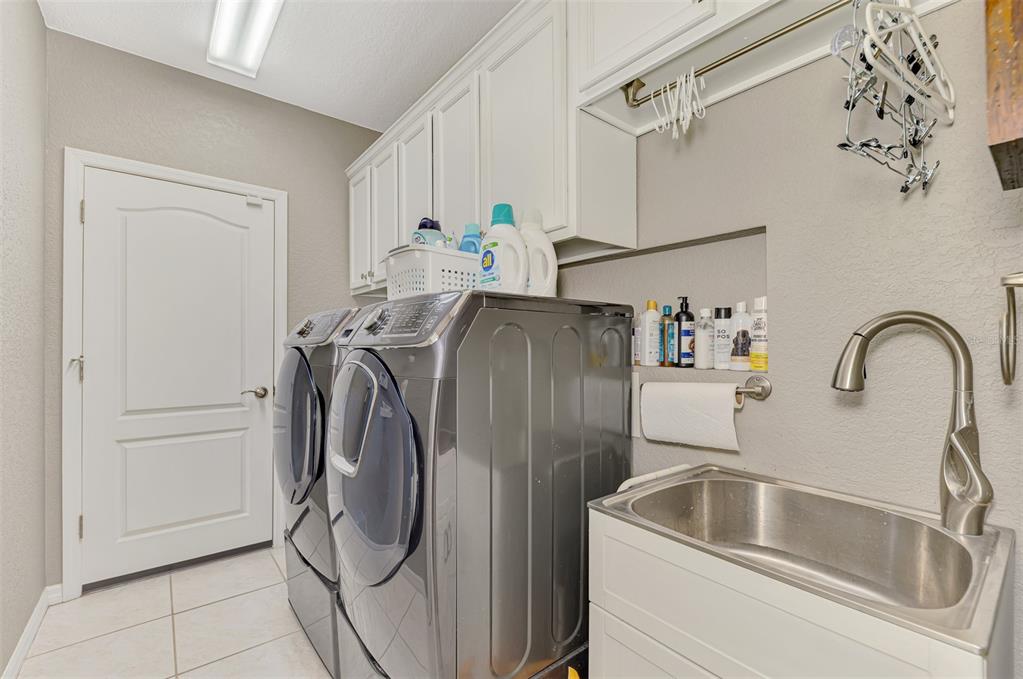 1771 Fountain View Circle Venice, FL 34292 - Photo 43 of 59 a utility room with dryer and washer