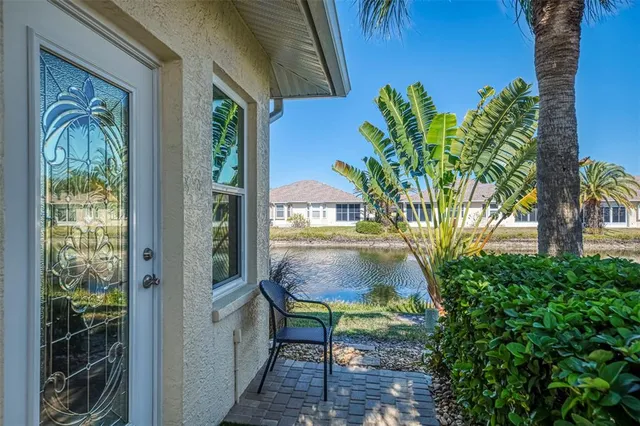 a front view of a house with a yard table and chairs