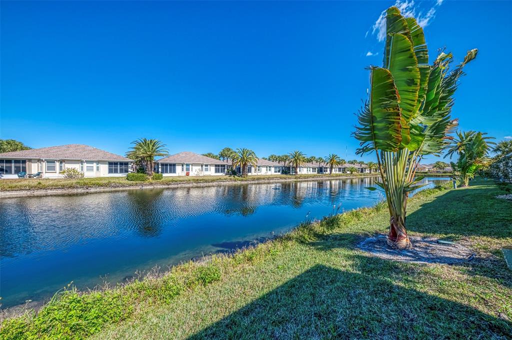 1771 Fountain View Circle Venice, FL 34292 - Photo 47 of 59 a view of a lake with a big yard