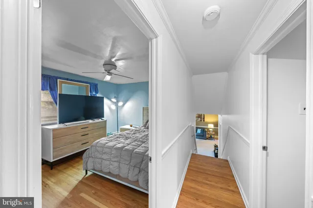 a bedroom with a bed and a view of bathroom