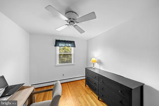a view of a kitchen with a sink and a window