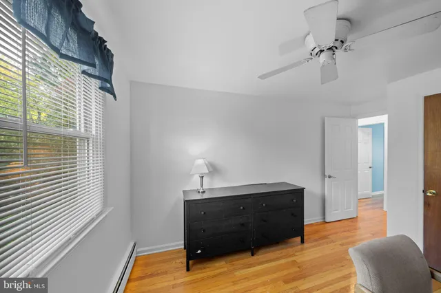 a room with a table and a chandelier