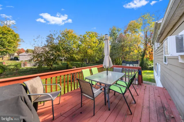 a view of a chairs and table on the wooden floor