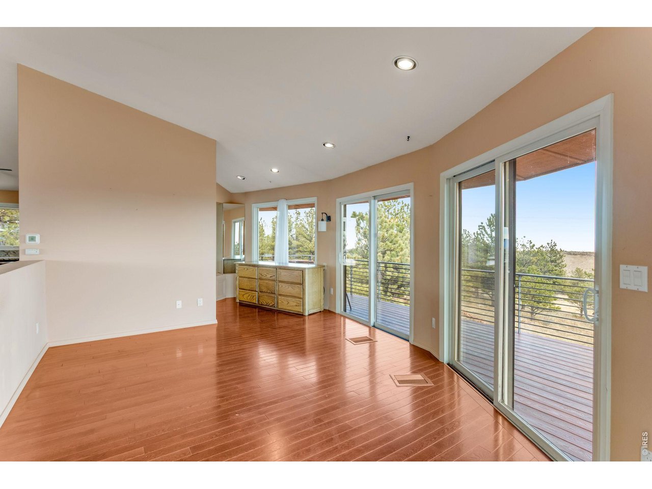 3001 Eagle Ridge Road Lyons, CO 80540 - Photo 26 of 50 a view of an empty room with wooden floor and a window