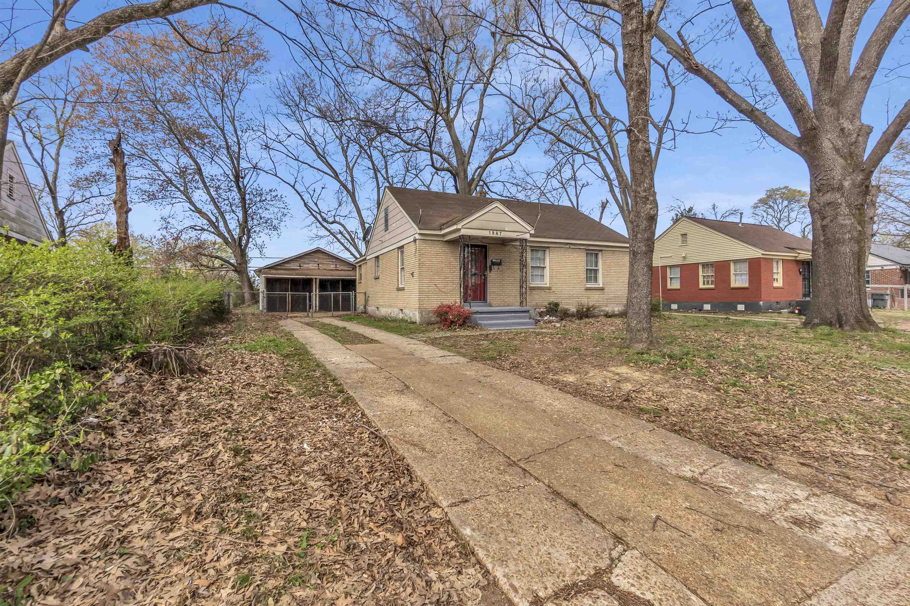 1887 North Graham Street Memphis, TN 38108 - Photo 2 of 13 front view of a house with a yard