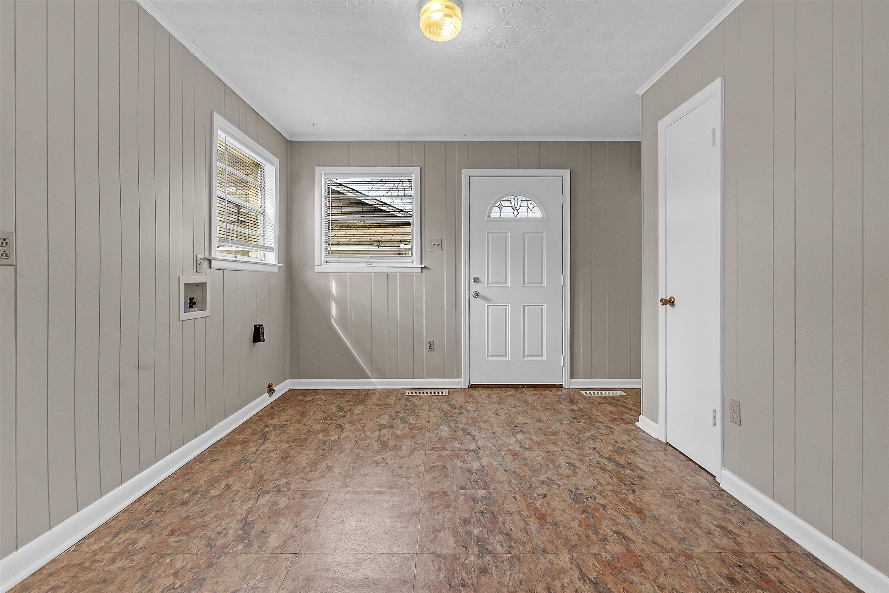 1887 North Graham Street Memphis, TN 38108 - Photo 5 of 13 a view of an empty room with window and closet area