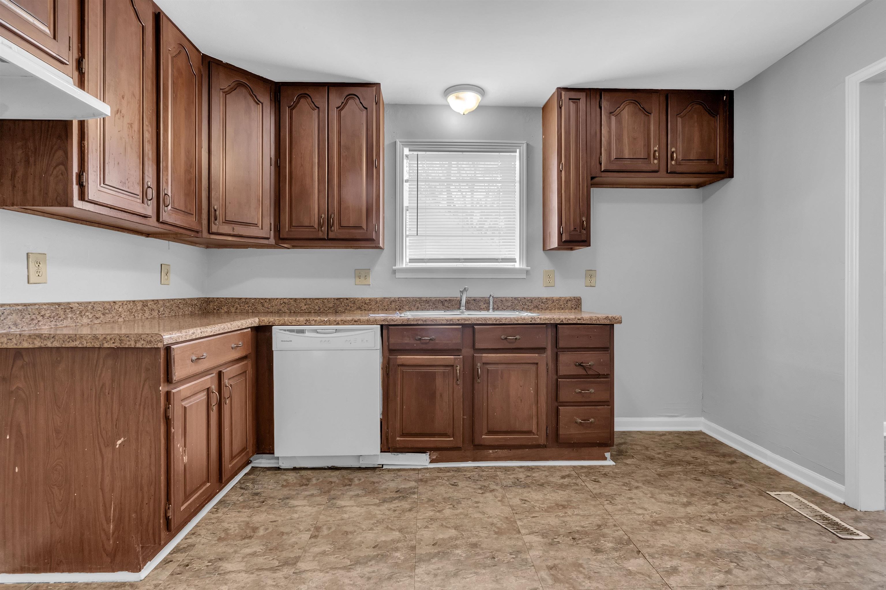 1887 North Graham Street Memphis, TN 38108 - Photo 9 of 13 a kitchen with stainless steel appliances granite countertop a stove a sink and a microwave