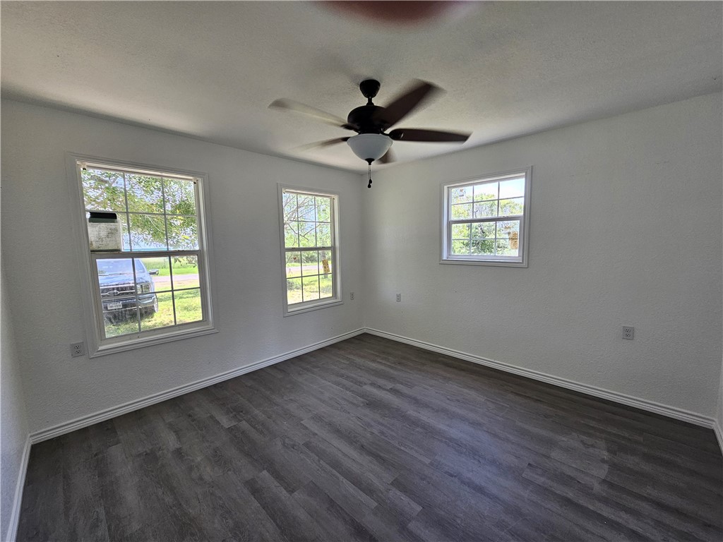 2001 1st Street Bayside, TX 78340 - Photo 15 of 26 a view of an empty room with wooden floor and a window