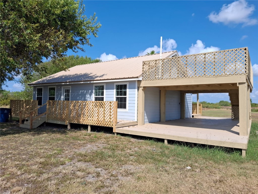 2001 1st Street Bayside, TX 78340 - Photo 2 of 26 a front view of a house with a garden