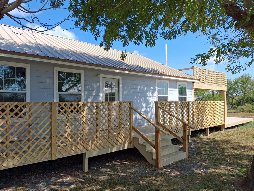 2001 1st Street Bayside, TX 78340 - Photo 22 of 26 a view of a house with a yard and deck