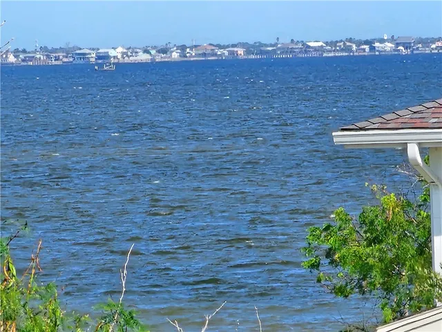 a view of balcony with wooden floor and city view