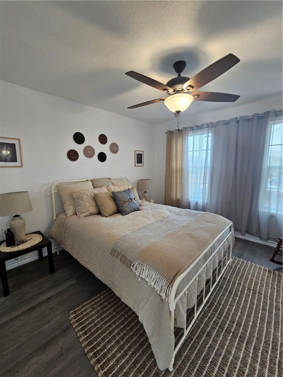 2001 1st Street Bayside, TX 78340 - Photo 6 of 26 a spacious bedroom with a bed and a chandelier