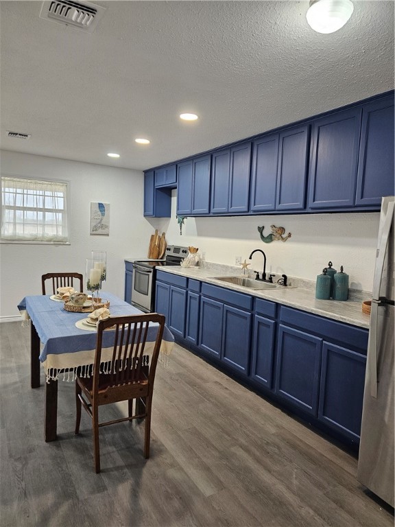 2001 1st Street Bayside, TX 78340 - Photo 8 of 26 a kitchen with granite countertop a sink and wooden cabinets