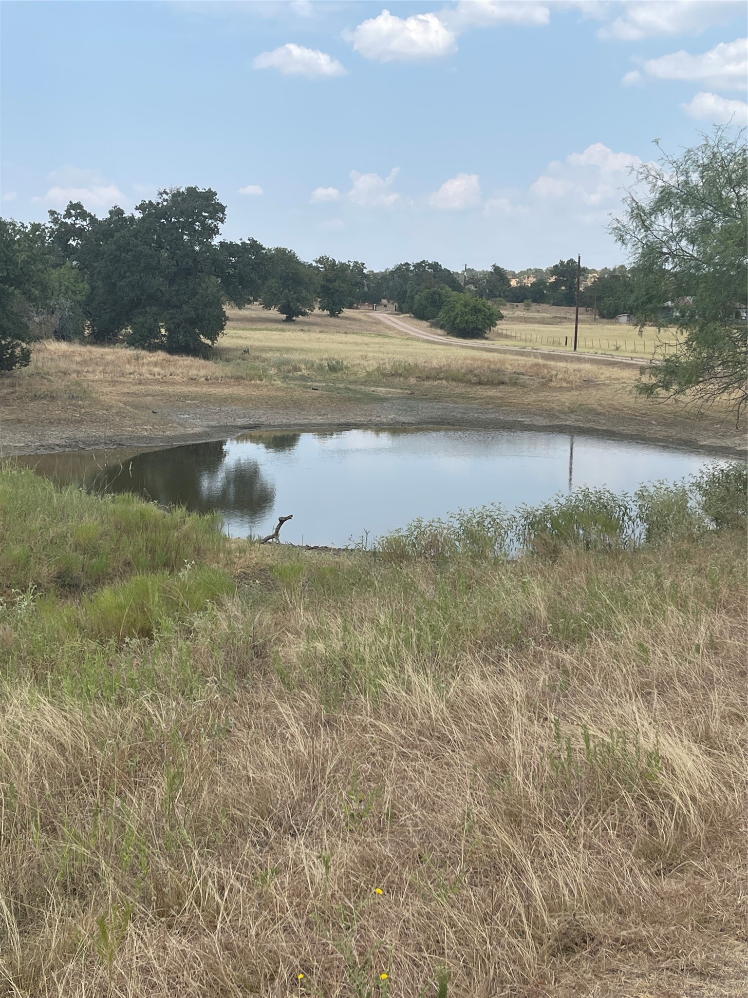 504 Sandy School Road Johnson City, TX 78636 - Photo 2 of 7 a view of lake with green space
